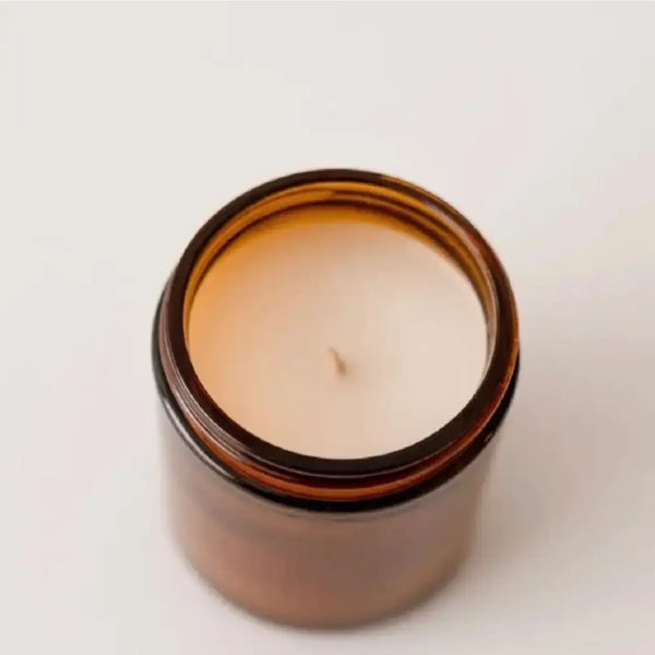 Top view of Christmas Cookie 9 oz amber jar soy candle showing wax and wick