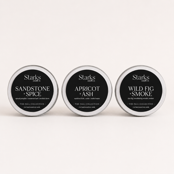 Three Fall Collection 4 oz candle tins standing upright: Sandstone + Spice, Apricot + Ash, and Wild Fig + Smoke