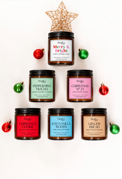 All six Starks Candle Co. holiday candles in festive tree arrangement